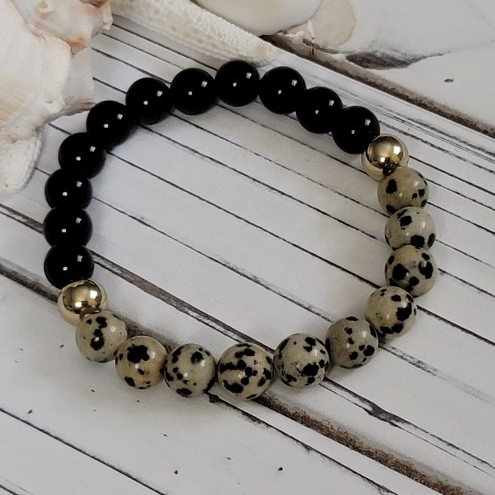 Dalmatian and black agate with gold beads. Beads are 8mm.